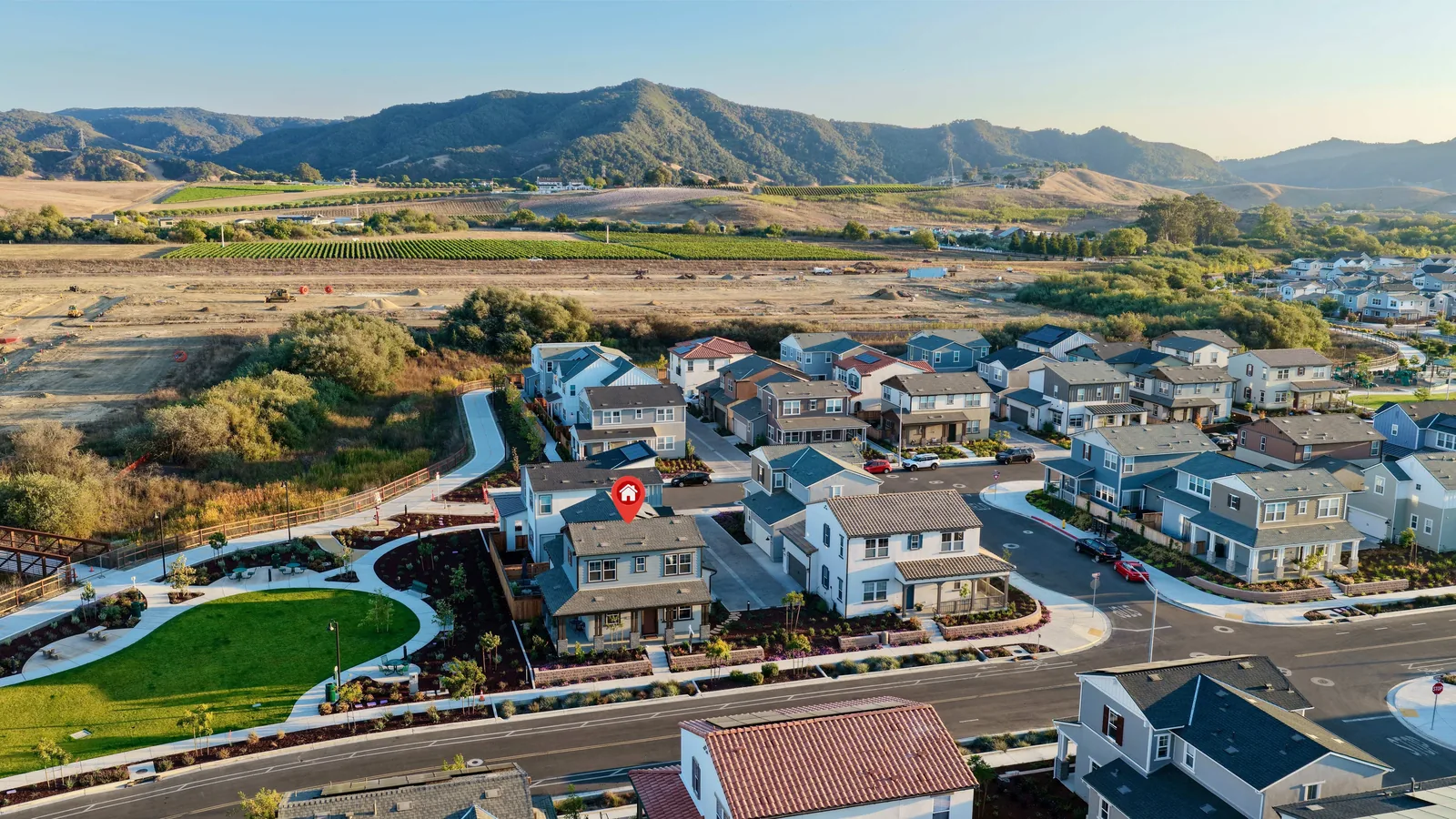 Aerial view of Avila Ranch with 240 Foxtrot Ct marked, the park and creek alongside and the hills beyond